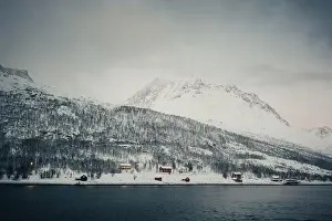 Brim Prints: Wooden cabins by the arctic ocean in the Lyngen Alps in northern Norway