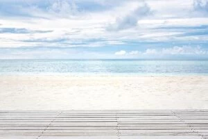 Images Dated 9th May 2018: Wooden floor over white sandy beach landscape, cloudy sky. Tranquil tropical pattern