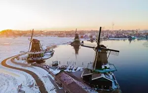 Wooden historical windmills Zaanse Schans windmill village during winter with snow