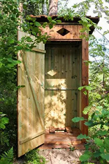 Holiday House Prints: Wooden outdoors toilet in the forest, with open door