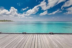 Images Dated 16th December 2018: Wooden table top on blue sea and tropical island beach background