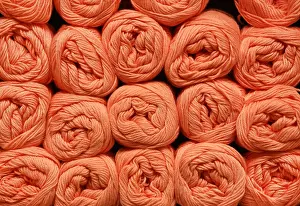 Handcraft Prints: Wool rolls in a shelf as a background