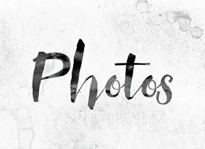 Photo Booth Prints: The word Photos concept and theme painted in watercolor ink on a white paper