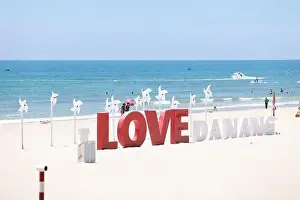 Idyllic Beach Prints: the wording installation I Love Da Nang on the beach of My Khe beach, Da Nang