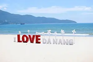 Idyllic Beach Prints: the wording installation I Love Da Nang on the beach of My Khe beach, Da Nang