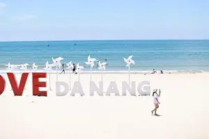 Idyllic Beach Prints: the wording installation I Love Da Nang on the beach of My Khe beach, Da Nang