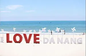 Idyllic Beach Prints: the wording installation I Love Da Nang on the beach of My Khe beach, Da Nang