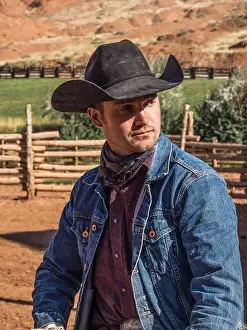 Horseman Prints: A working cowboy wrangler in his cowboy hat and bandana on the Red Cliffs Ranch near Moab