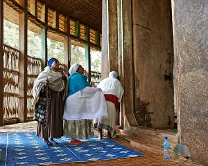Worshippers praying at The Ura Kidane Mihret
