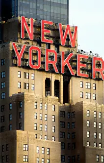 Rise Prints: Wyndam New Yorker Hotel Building in New York City with Red Type Brownstone Facade & Office Windows Light Blue Sky