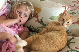 Lesser Prints: Four year old girl on the couch with her cat