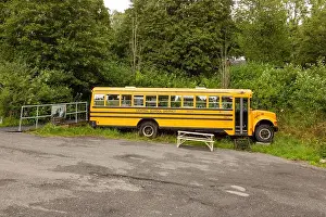 Novelty Prints: Yellow American school bus converted into a rum distillery