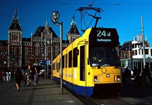 Europaeische Prints: Yellow tram in front of the Central Station, Amsterdam