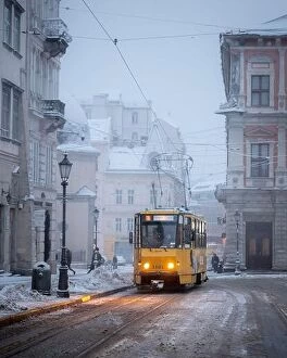 Sea Collection: Yellow tram on Market central square in winter Lviv city, Ukraine, Europe. Morning cityscape