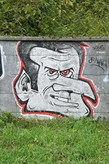 Aerosol Prints: “Yo Manu” political satire. Spray painted graffiti caricature mocking French President Emmanuel Macron