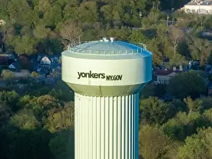 Yonkers, NY, USA - 05-02-2024: Aerial photos of green elevated water tower located in Yonkers, New York, USA