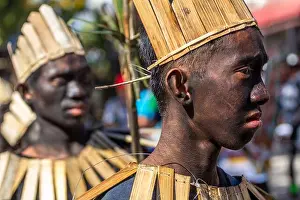 Traditional Craft Prints: Young Ati-Ati Festival dancers painted black and wearing costumes made of natural materials in Aklan