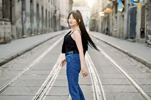 Denim Prints: Young beautiful Asian girl with ponytail black hair