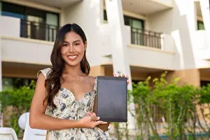 Tanned Prints: Young beautiful Asian woman using digital tablet computer outdoors