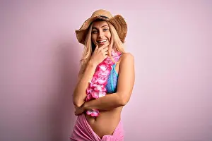 Crossed Prints: Young beautiful blonde woman on vacation wearing bikini