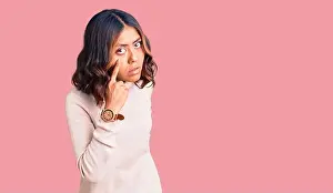 Mixed Race Prints: Young beautiful mixed race woman wearing winter turtleneck sweater pointing to the eye watching you gesture