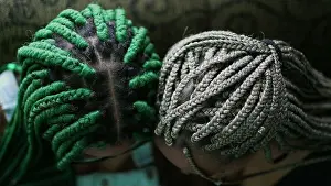 Braids Prints: Two young black latina women with box braids hairstyle looking at camera