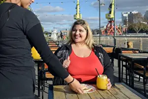 Waitress Prints: young blonde plus size latin woman smiling very happy
