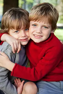 Sweaters Prints: Two Young Boys Hugging Each Other