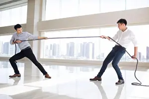 Well Dressed Prints: Young businessmen pulling rope