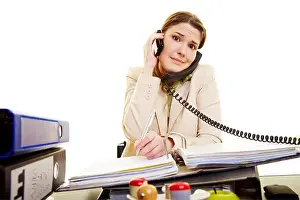 Chaos Prints: Young businesswoman on two phones taking notes
