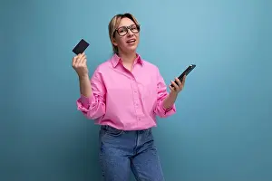 Cashless Prints: young caucasian blond leader careerist woman with ponytail with glasses dressed in a pink blouse uses a card