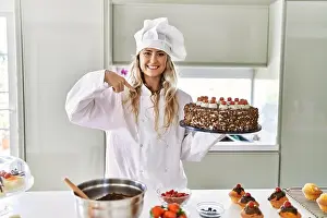Surprised Prints: Young caucasian pastry chef woman cooking pastries