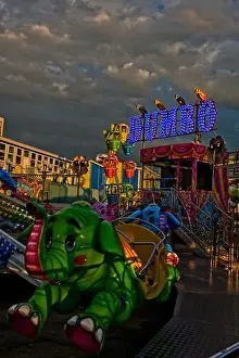 Fairground Prints: A young children's Dumbo the Elephant ride at Clarence Pier Funfair