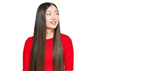 Side Profile Prints: Young chinese woman wearing casual clothes looking away to side with smile on face