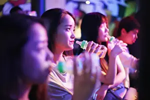 Baby Bottle Prints: Young Chinese women enjoy beer with plastic baby bottles prepared to mark the National Breastfeeding Promotion Day at a