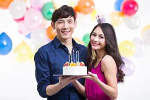Young Couple Prints: Young couple celebrating birthday