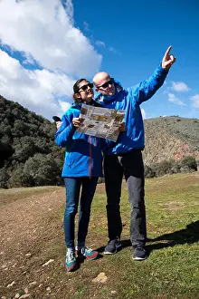 20 25 Prints: Young couple hiking in rural landscape