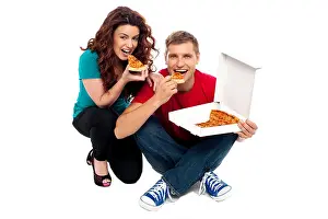Appetite Prints: Young couple sitting on floor and enjoying yummy pizza
