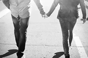 Holding Hands Prints: Young couple spring city, relax have fun