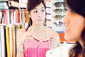 Things Prints: A young, cute, Thai woman shops for sundries and the things that she likes in Siam Square