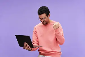 Casualwear Prints: Young excited programmer in eyeglasses