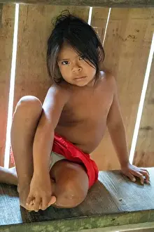 Young Female Yagua Child wears Traditional Dress in the Peruvian Amazon