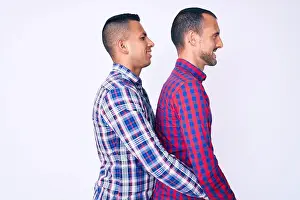 Lateral Prints: Young gay couple of two men wearing casual clothes looking to side
