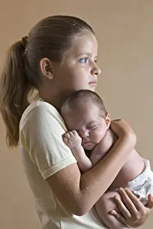 Simple Living Prints: A young girl holding her baby sister closely