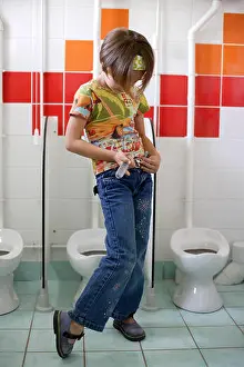 Toilets Prints: Young girl in the toilets at preschool
