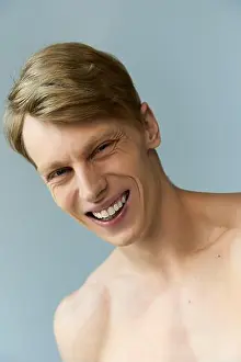 Allure Prints: A young, handsome man embodies modern masculinity with his charming smile and confidence