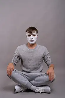 Sleeves Prints: Young handsome man wearing white mask against gray background