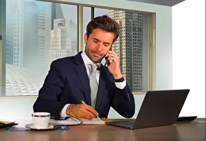 Wall Street Prints: young happy and attractive successful businessman working at modern office in central business district smiling