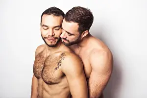Cuddling Prints: Young homosexuals gay couple love each other on a white background
