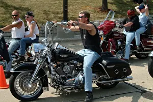 Cruiser Prints: A young man on his Harley davidson motorcycle with raised handle bars